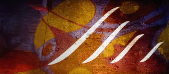 Der IBYKUS Flügel projeziert an eine Wand mit bunten Farben